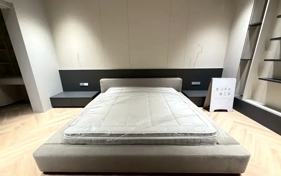 Accessible upholstered bed designed for easier sitting and standing